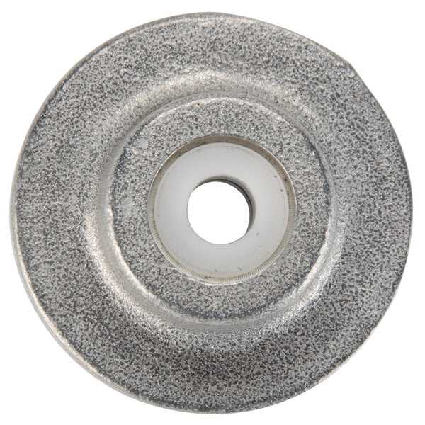 A round metal plunger with a hole in the center.