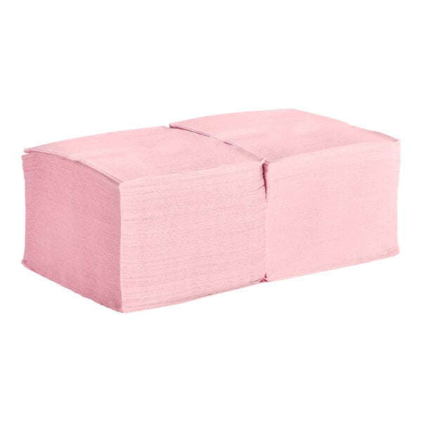 A stack of pink 2-ply beverage or cocktail napkins.