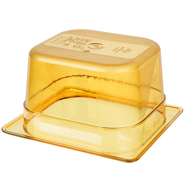 A yellow Rubbermaid plastic food pan with a lid.