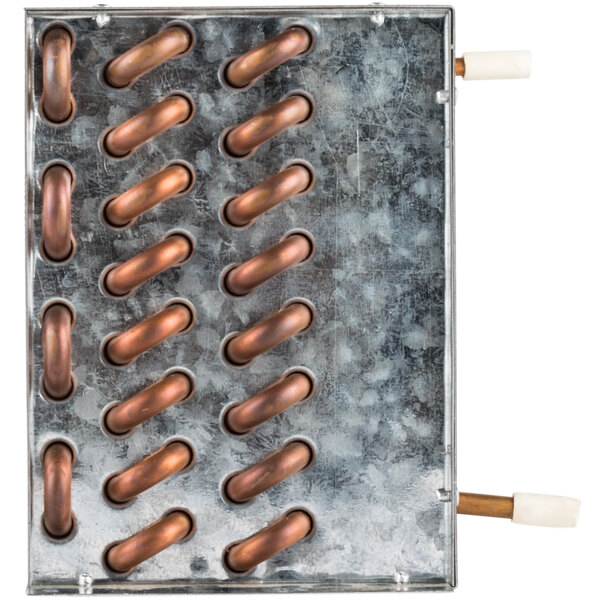 A metal plate with copper pipes on it.