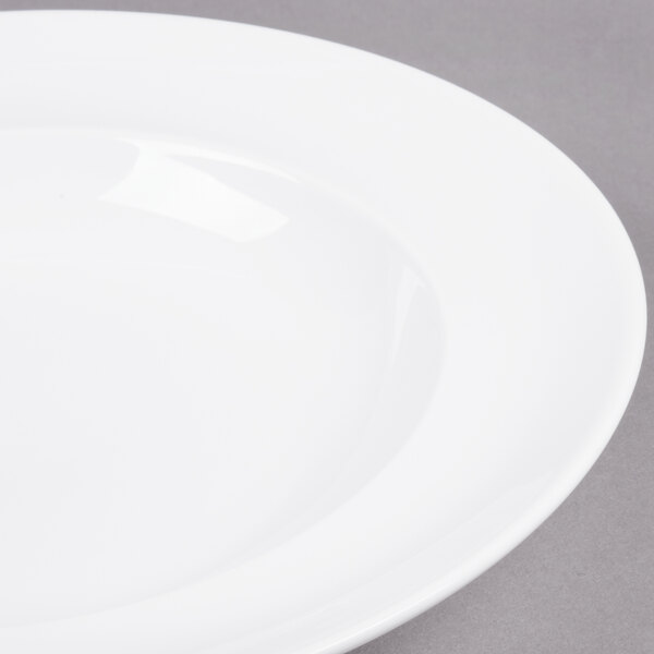 A close-up of an Arcoroc Vintage white soup plate with a white rim.