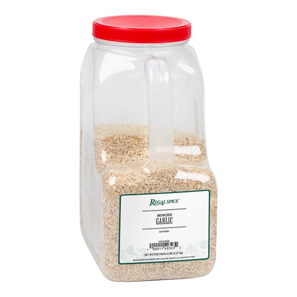 A plastic container of Regal Minced Garlic with a red lid.