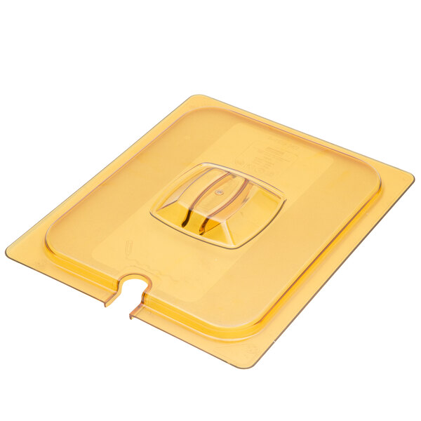 A yellow plastic lid with a notch for a Rubbermaid food container.