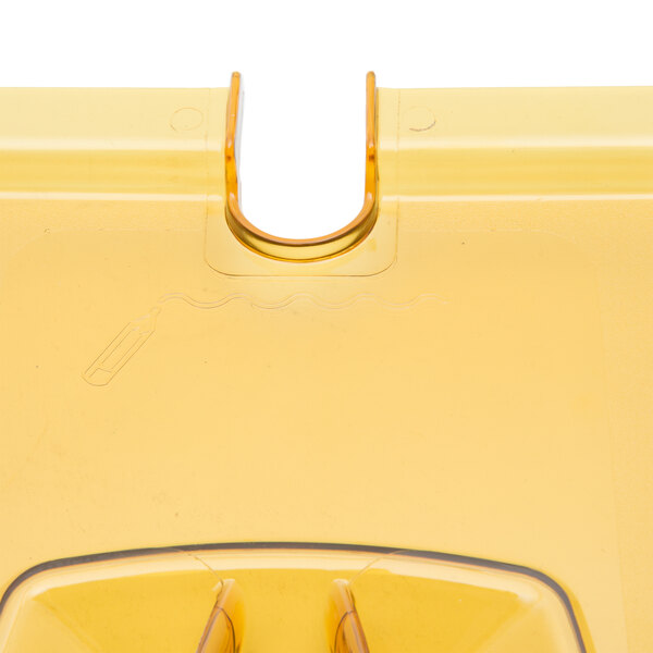 A yellow plastic Rubbermaid lid for a food pan with a handle.