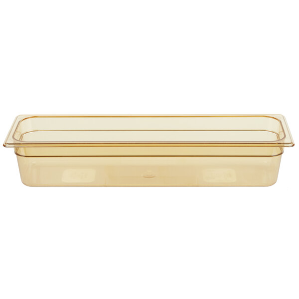 A Rubbermaid amber plastic food pan on a counter.