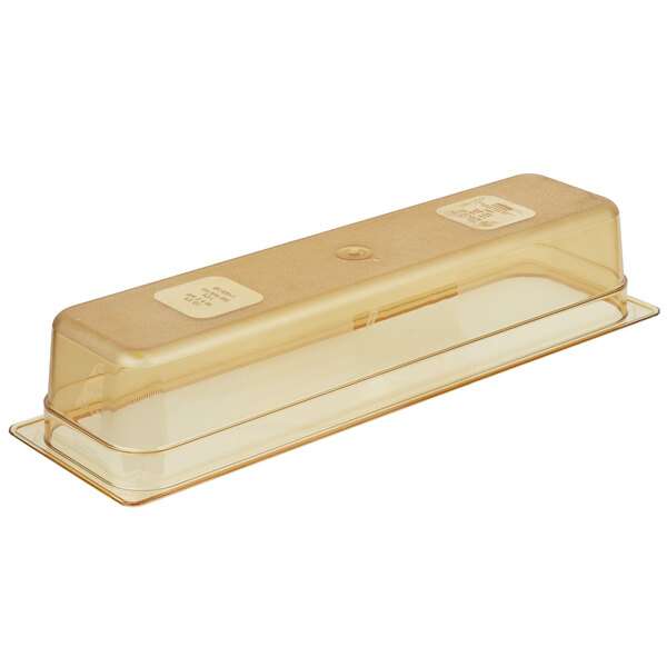 A Rubbermaid amber plastic food pan with a lid.