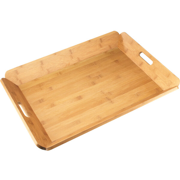 a wooden tray with handles