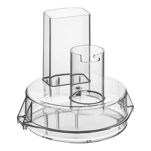 A clear plastic lid on a clear glass cylinder.