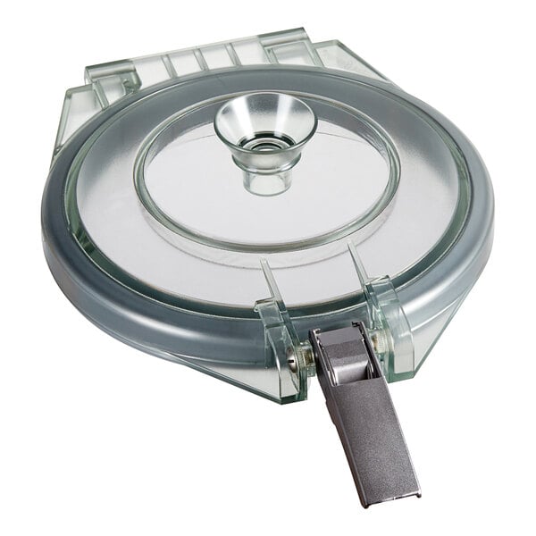 A clear glass lid with a grey metal handle.