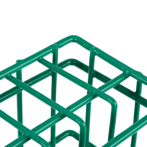 A green wire Microwire 12 compartment catering plate rack on a counter.