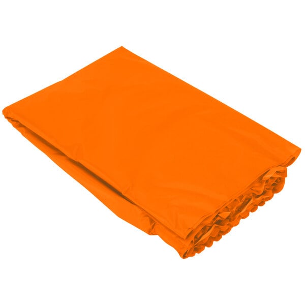 A Sunkissed Orange plastic table skirt with ruffled edges on a white background.
