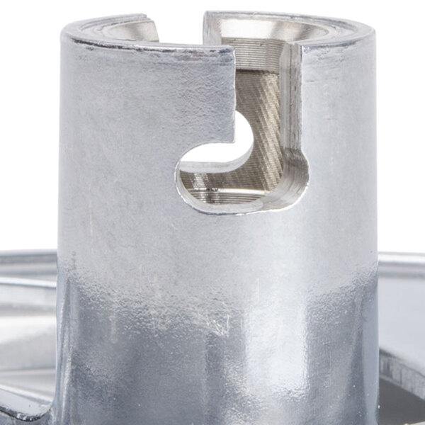 A Robot Coupe 3/8" slicing disc, a silver metal disc with a hole in it.