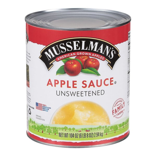 A #10 can of Musselman's Natural Unsweetened Applesauce on a table.