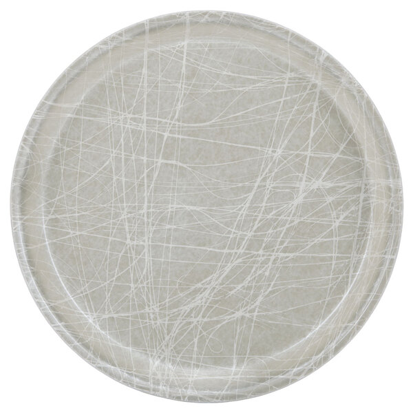 A white round Cambro fiberglass tray with a gray abstract design.