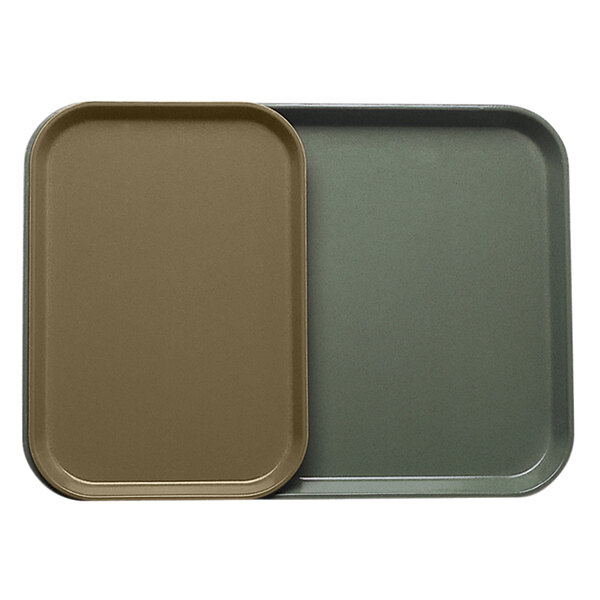 A brown Cambro rectangular tray insert with a green Cambro tray.