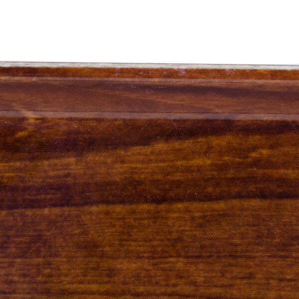 A close up of a wood surface.