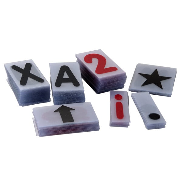 A stack of white cards with black letters and red numbers.