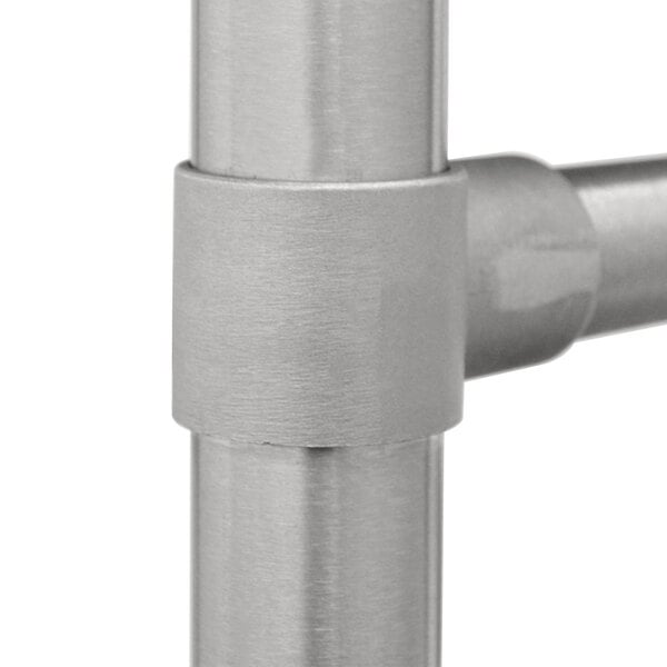 A close-up of the metal cylinder on a stainless steel Advance Tabco pot sink.