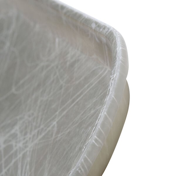 A close-up of a Cambro Abstract Gray fiberglass tray.