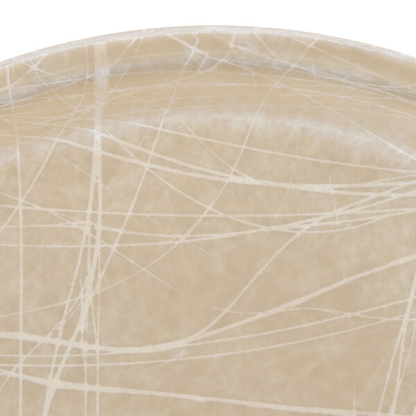 A close up of a beige Cambro Camtray with white lines.