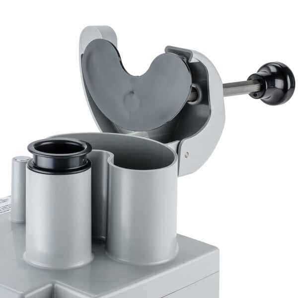 A grey plastic Robot Coupe Vegetable Prep Attachment kit with a white cover.