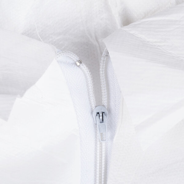 A close-up of a zipper on a white Cordova disposable coverall.
