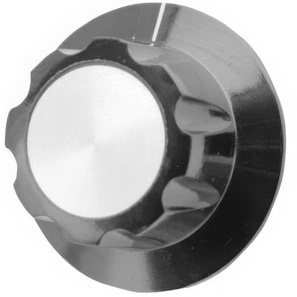 A close-up of a black and white AllPoints oven knob with a silver pointer.