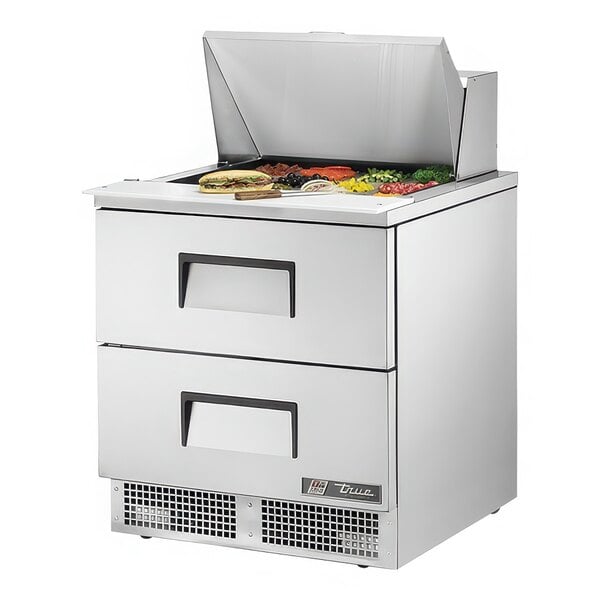 A True 2 drawer mega top refrigerated sandwich prep table on a counter.