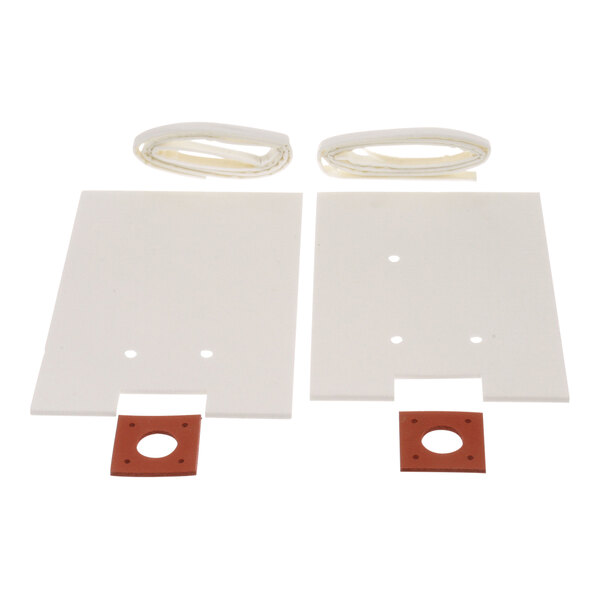 Two white rectangular plastic pieces with holes and red rubber seals.