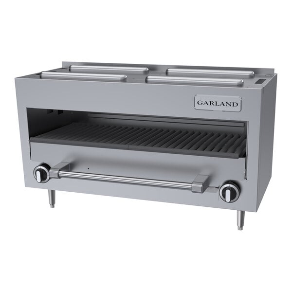 A stainless steel countertop infra-red salamander broiler with control knobs and a grill surface.