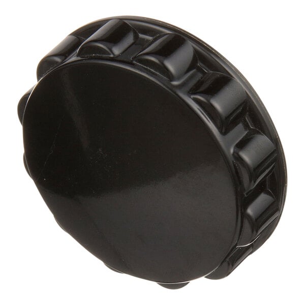 A black circular fluted knob.