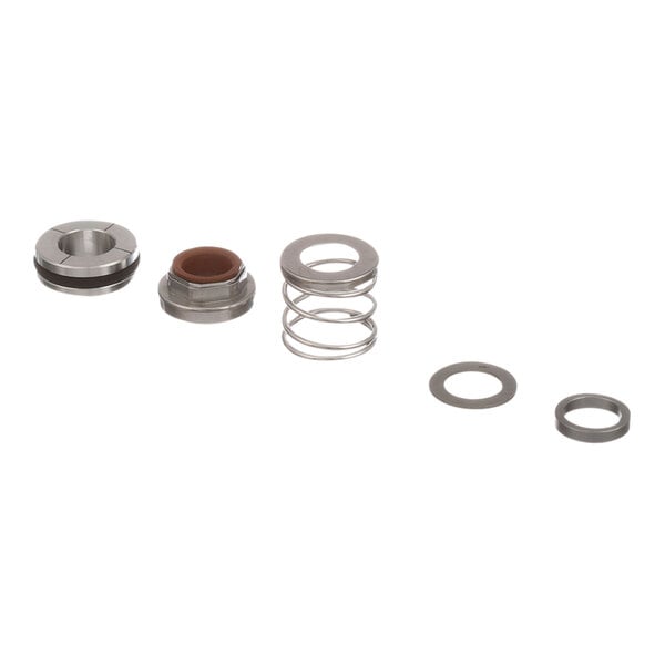 A set of metal parts including a circular metal object and a metal spring with a hole.