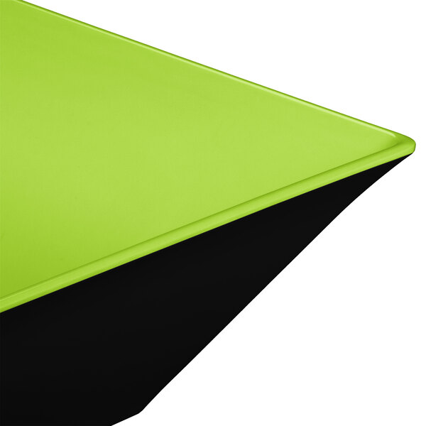 A green square melamine bowl with a black base.