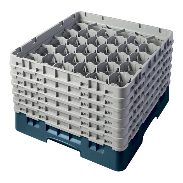 A teal plastic Cambro glass rack with compartments and extenders.