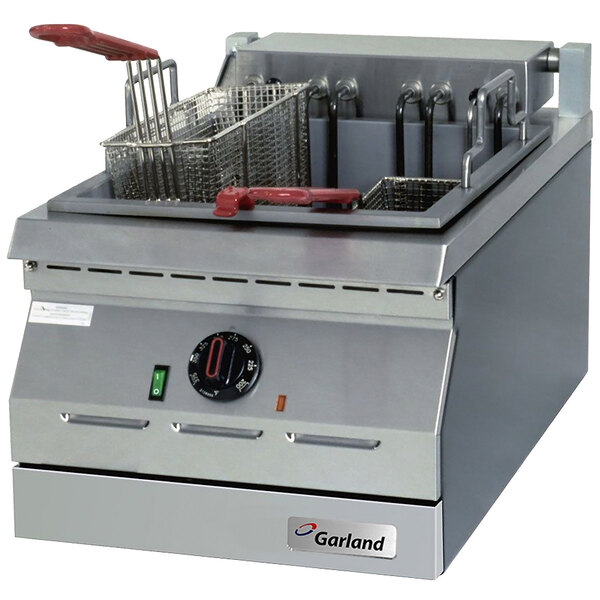 A Garland dual tank electric countertop deep fryer with two baskets.