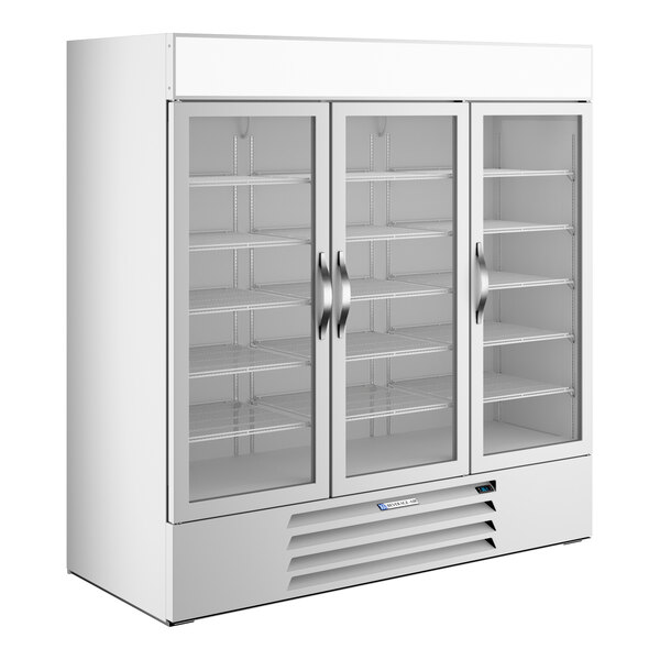 A large white refrigerated glass door merchandiser with three doors and interior shelving.