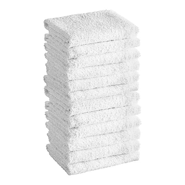 A stack of twelve folded white textured towels.