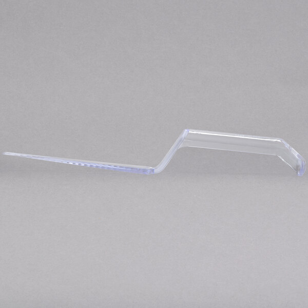 A clear plastic pie server with a handle.