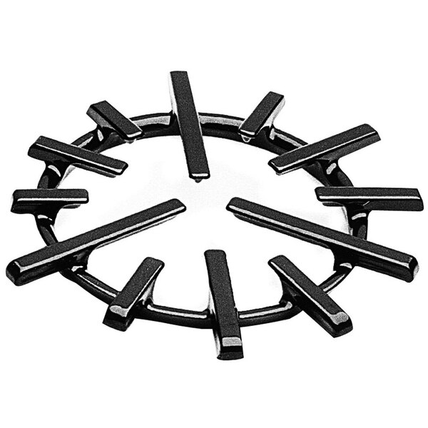 A black cast iron spider ring grate with many lines.