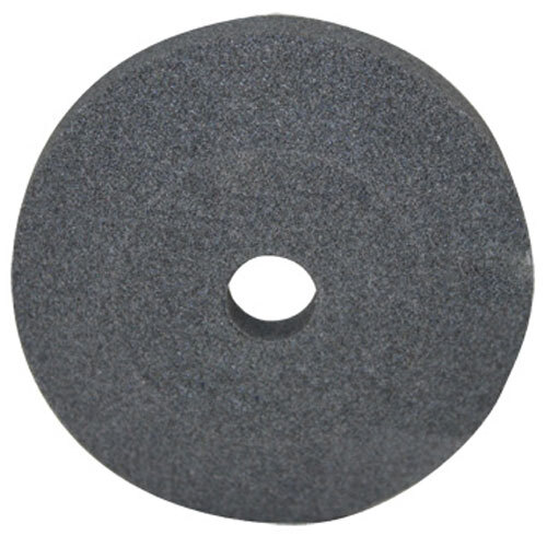 A black circular sharpening stone with a hole in the center.