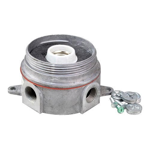 A white metal junction box with a silver lamp inside and screws.
