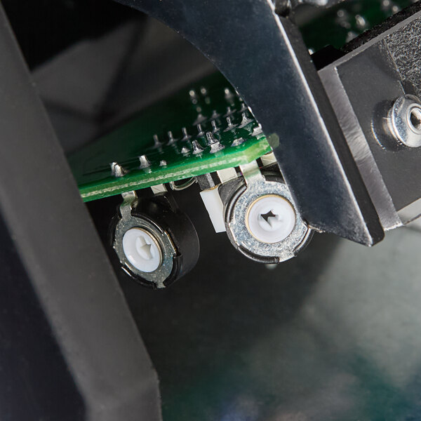 A close up of the circuit board inside an American Dryer ExtremeAir hand dryer.