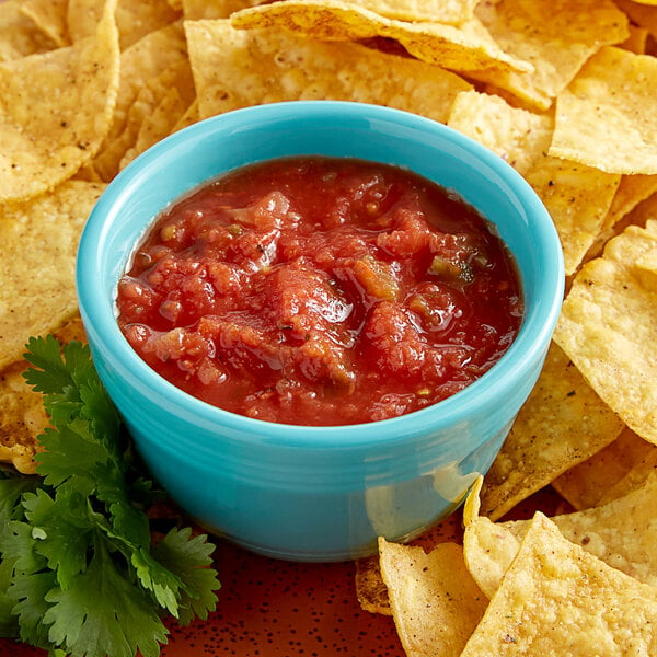 A bowl of Dei Fratelli medium salsa and tortilla chips.