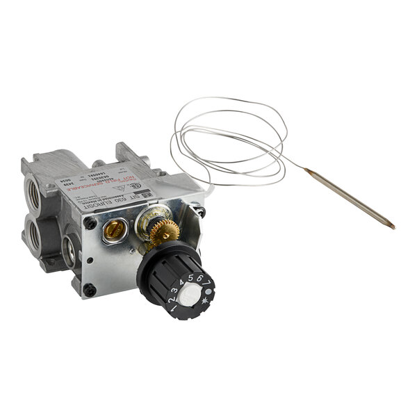 A white US Range gas valve with a wire attached.