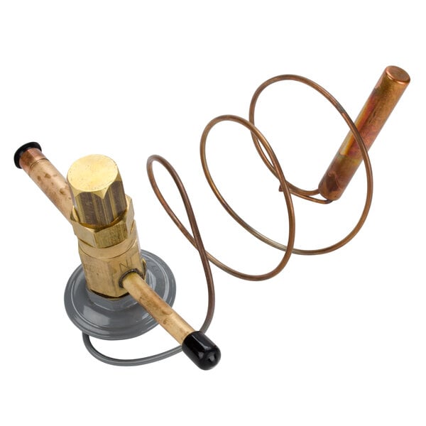 A close-up of a Delfield copper thermal expansion valve.