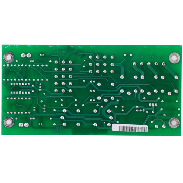 A green Frymaster interface board with white and silver dots.