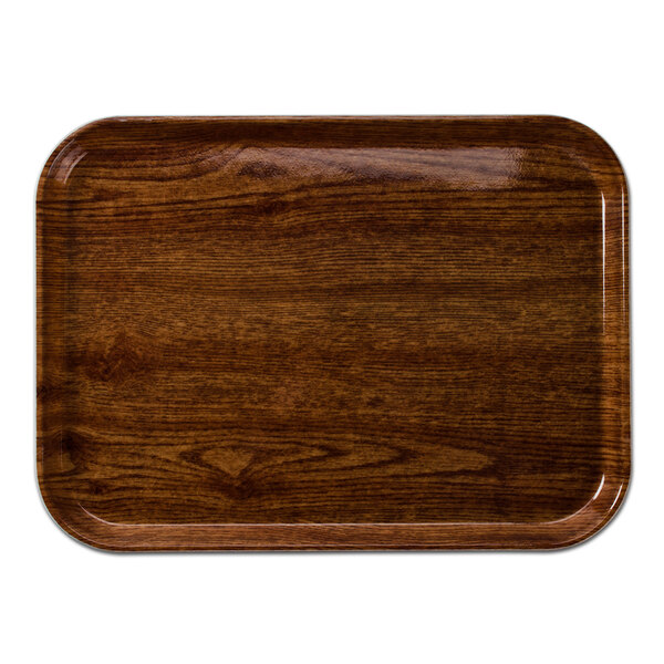 A rectangular wood Cambro tray with a dark wood finish.