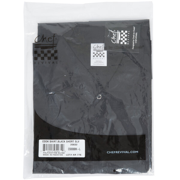 A black Chef Revival short sleeve cook shirt in a package with a white label.