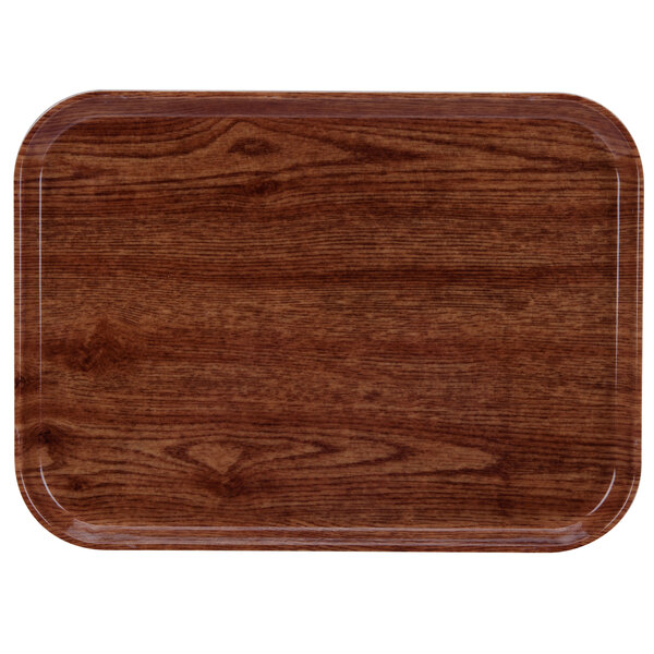 A rectangular wooden tray with a dark wood finish and a white border.