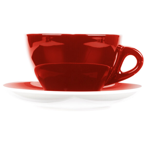 A close-up of a CAC Venice red coffee cup and saucer with a white background.